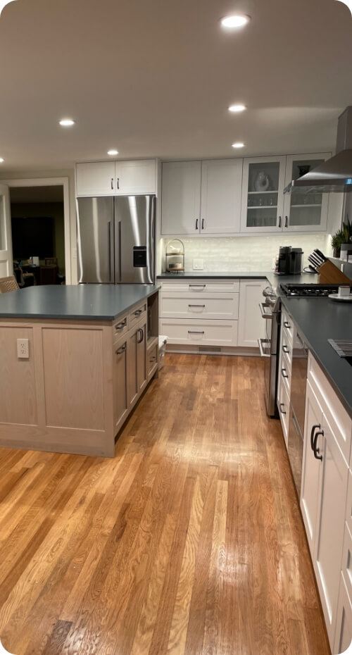 A stylish kitchen space featuring a combination of light and dark elements.